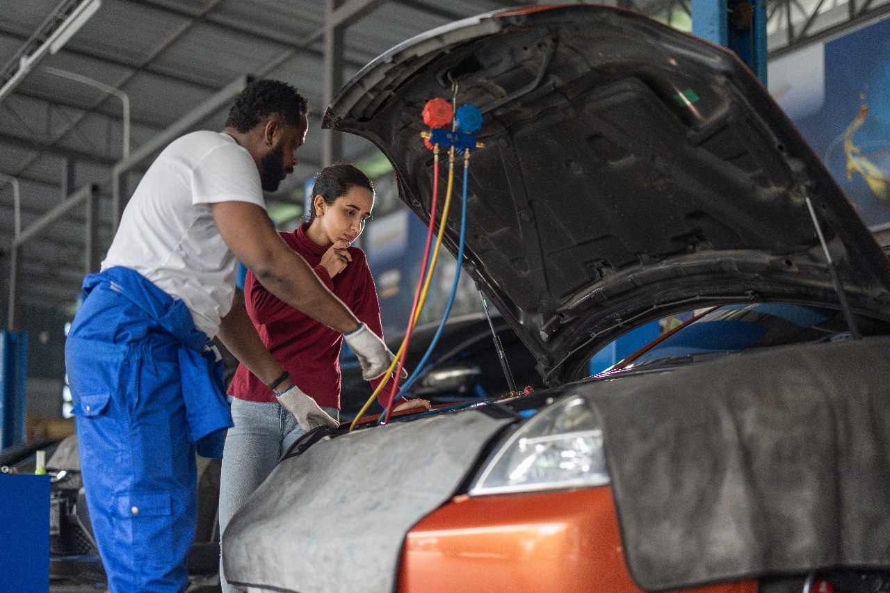 Mechanic providing jump start service